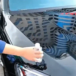 SOPAMI spray bottle being applied on white car